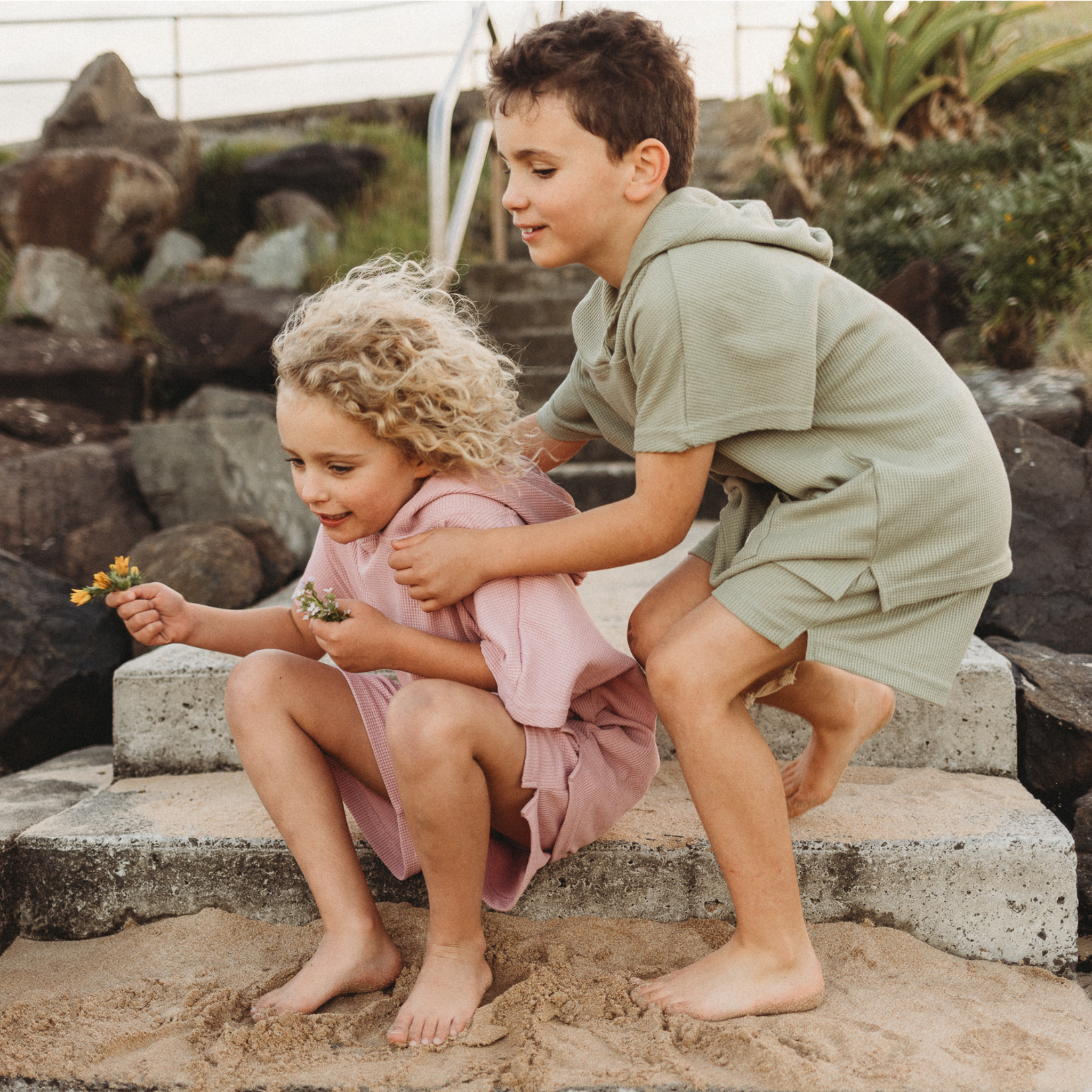 boy and girl wearing hooded towel set