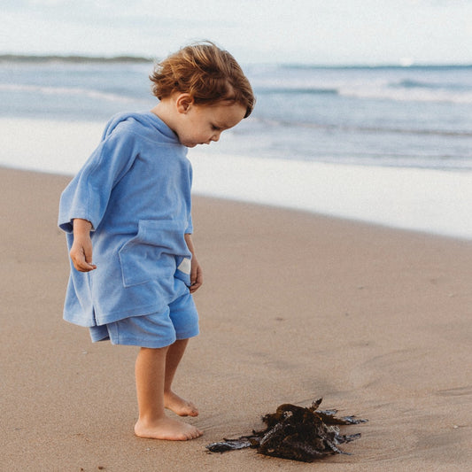 toddler wearing blue Terry hooded towel 